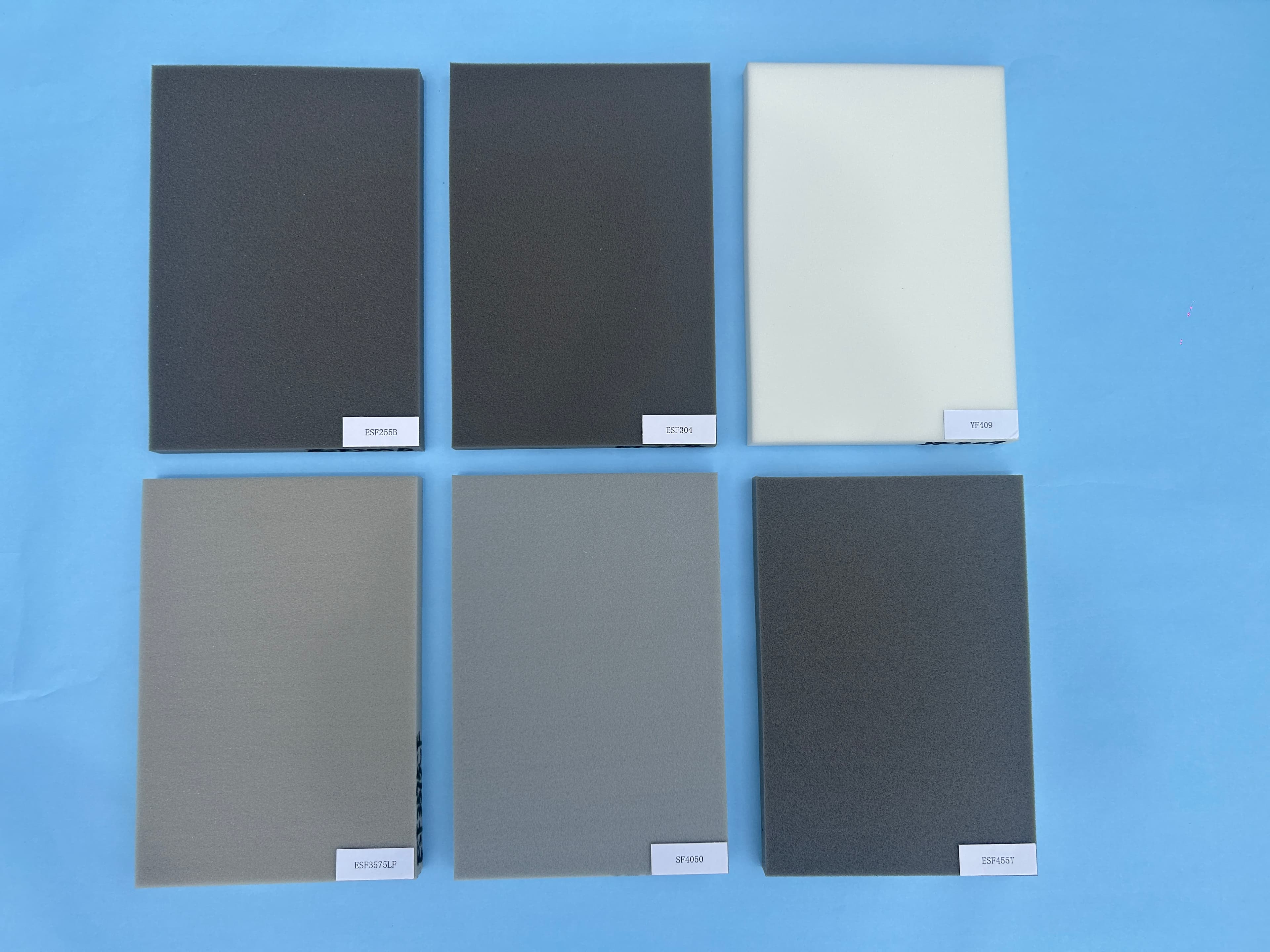 Laminated and adhesive-backed foam sample sheets